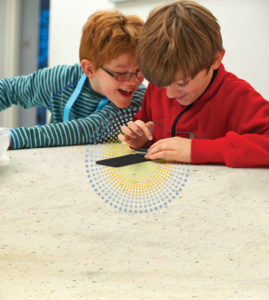 Corian mobile charging surface - kids playing